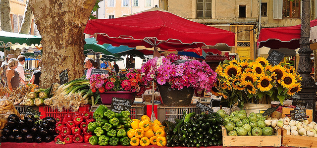 Market day in Aix-en-Provence — stalls of produce under the plane trees
