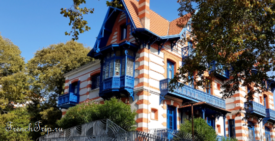 An ornate villa with blue woodwork in the Ville d'Hiver, Arcachon