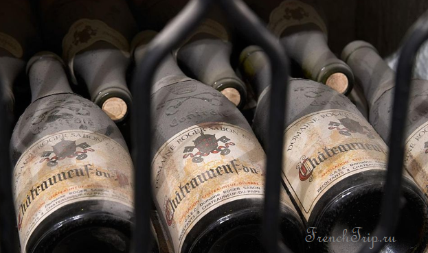Bottles of Châteauneuf-du-Pape ageing in a cellar