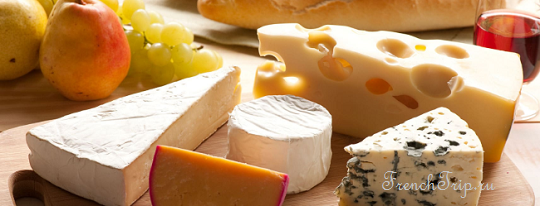 A French cheese board with brie, blue cheese and hard cheese