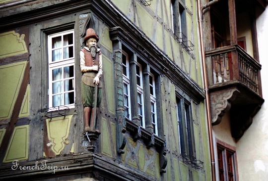 A carved figure on a house front in Colmar