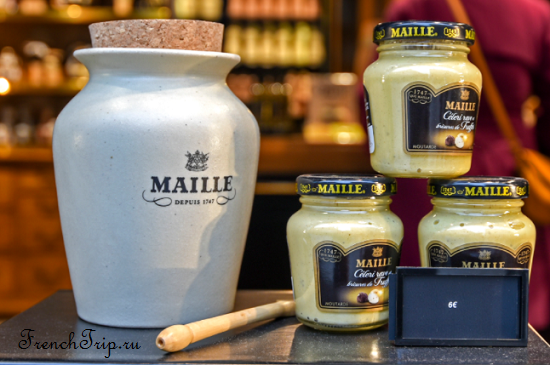 Dijon mustard in a stoneware jar