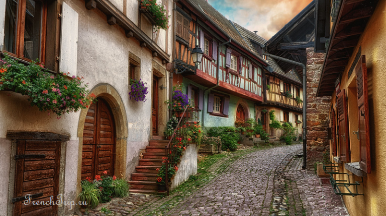 A curving street of timber-framed houses in Eguisheim