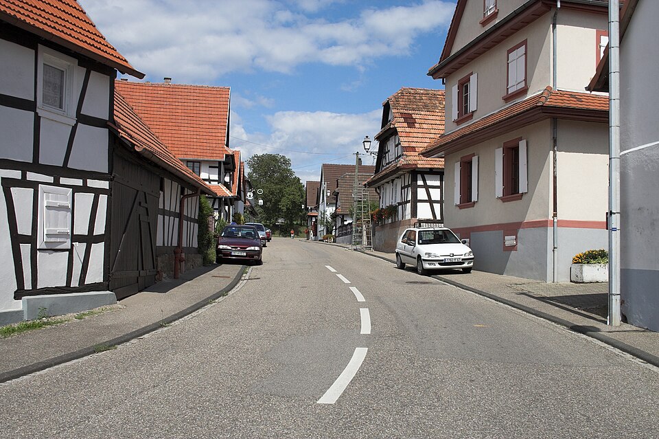 A street of white timber-framed houses in Hunspach
