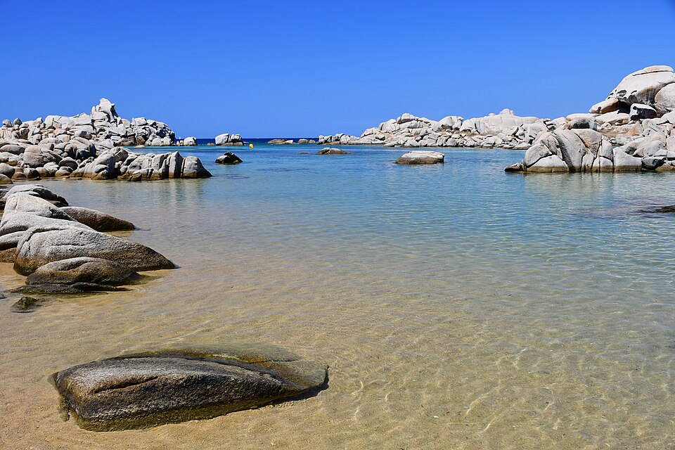 A shallow turquoise cove among granite boulders on the Lavezzi islands