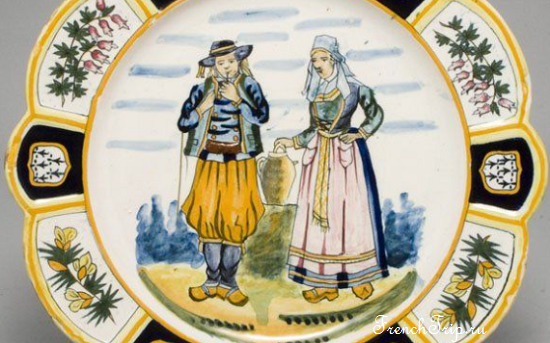 A Quimper faience plate with a Breton couple