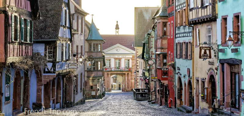 Painted houses along the street in Riquewihr