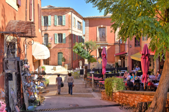 Café terraces on the square in Roussillon