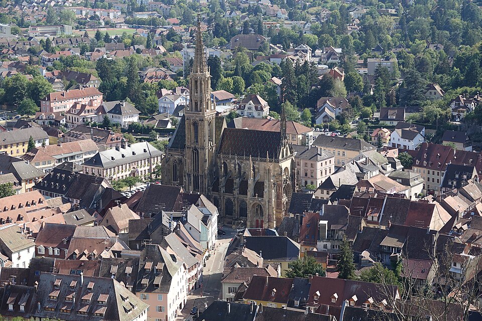 The spire of Saint-Thiébaut rising above the roofs of Thann