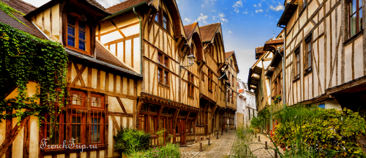 A street of leaning half-timbered houses in Troyes