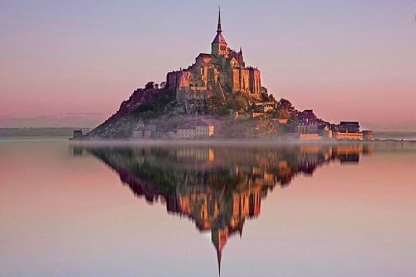 Mont-Saint-Michel reflected in the bay at dawn