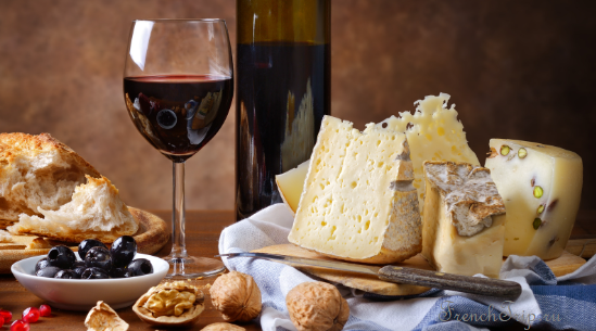 Red wine with cheese, bread and olives