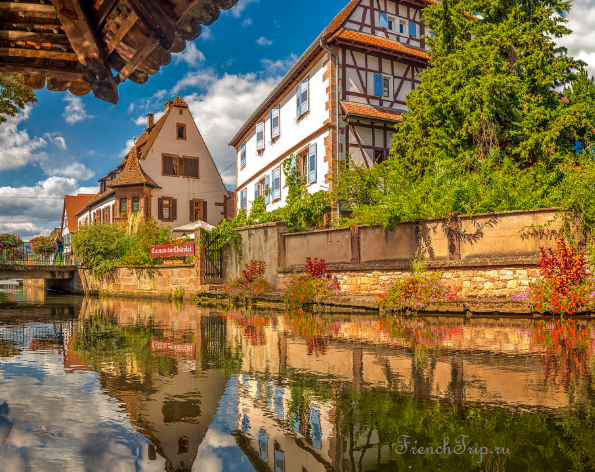 Half-timbered houses reflected in the Lauter at Wissembourg