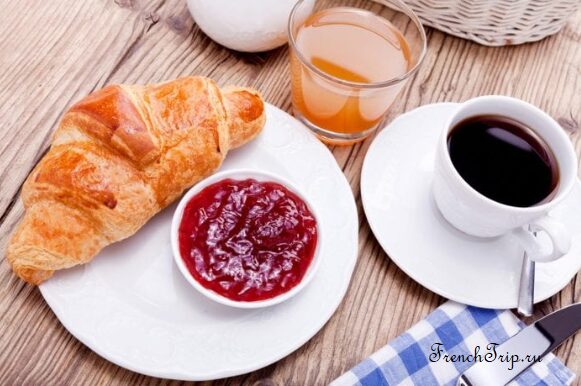 A croissant with a cup of coffee, the standard French breakfast