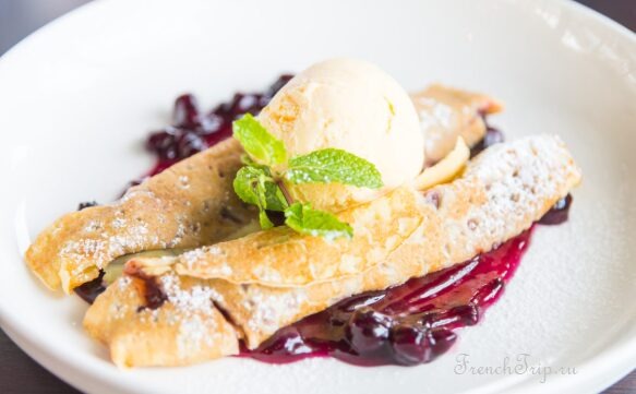 A crepe folded around its filling in a creperie