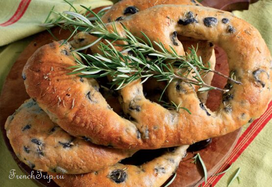 Fougasse, the flat Provencal bread cut open by the baker